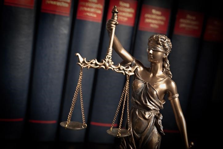 A lady justice figurine. | Litigation Lawyer