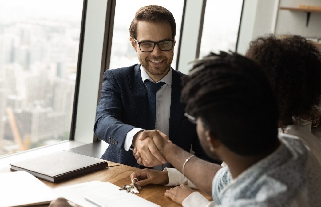 Attorney handshakes client